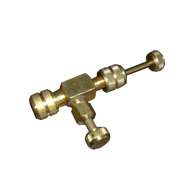 Outil extracteur de valve en pression